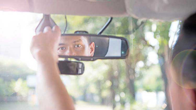 Driver looking in rearview mirror